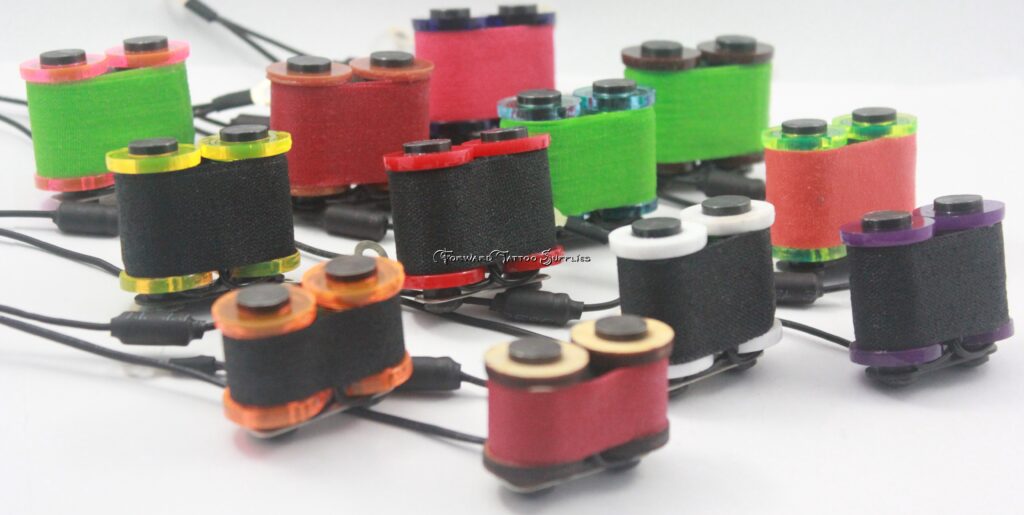 Colorful mini spools with black connectors.