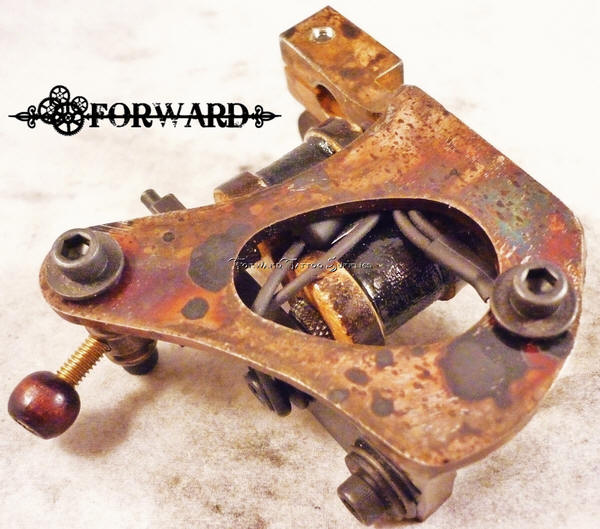 Vintage tattoo machine with rusted finish.