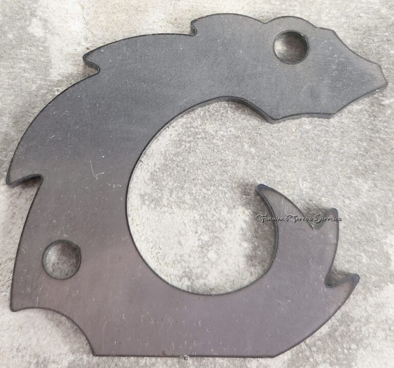 Metal cutout resembling a stylized animal shape.