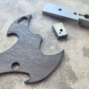 Metal parts on a textured surface.