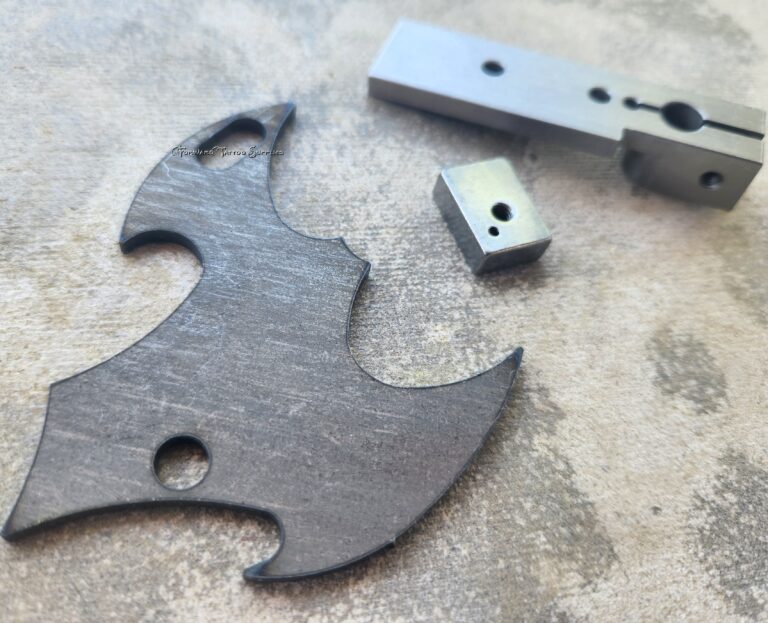 Metal parts on a textured surface.