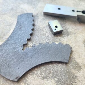 Metal components on a textured surface.