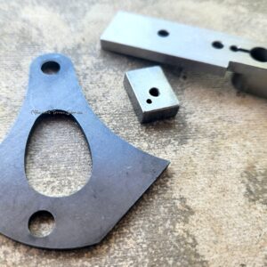 Metal components on textured surface.