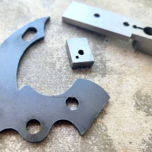 Metal components on a textured surface.