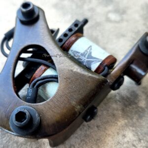 Close-up of a rusty mechanical part with bolts and metal components.