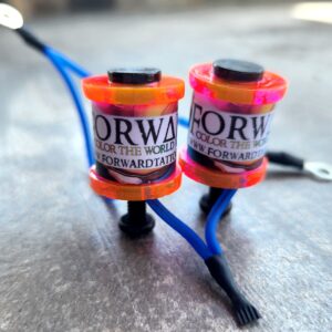 Close-up of two colorful wristbands with the text 'ORW' and adjustable straps.
