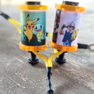 Custom fishing rod holders featuring Pikachu and Ash from Pokémon.