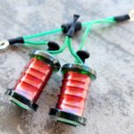 Close-up of red and green traditional firecracker string.