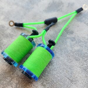 Two green micro coil pickups for an electric guitar.