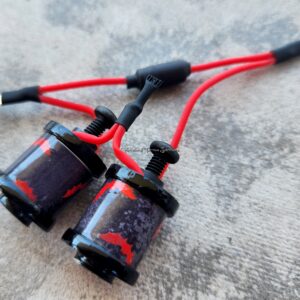 Close-up of black and red fishing rod guides.