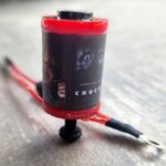 Close-up of red-topped tattoo rotary motor