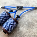 Close-up tattoo machine coils with blue wires