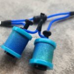 Close-up of blue tattoo grips