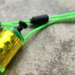 Green wires with yellow holographic cylinder