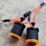 Black tattoo grips with orange wires