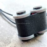 Close-up of tattoo machine coils with wires