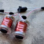Red coils encased in clear plastic holders.